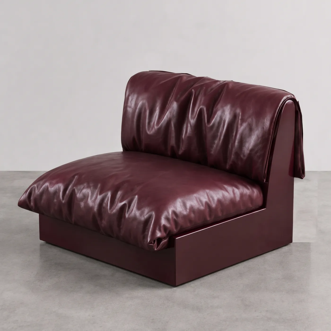 Undone Seat, a burgundy leather armchair